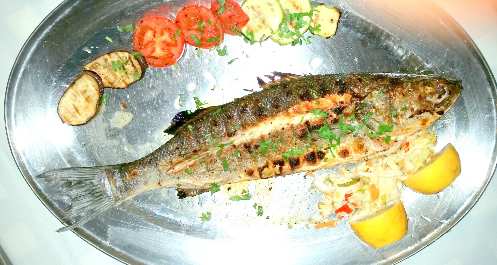 Juicy grilled fresh fish at Thea Thalassa by placescases.com