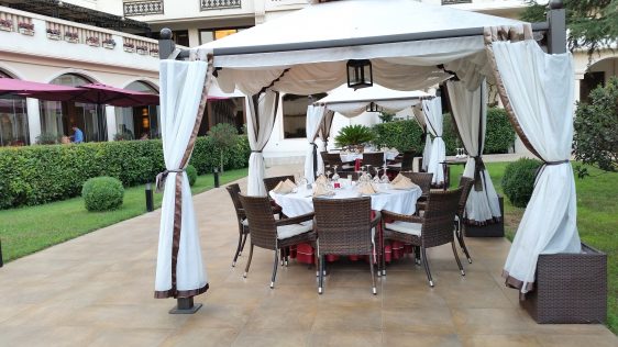 Cozy tables under the white gazebos at Salini by placescases.com