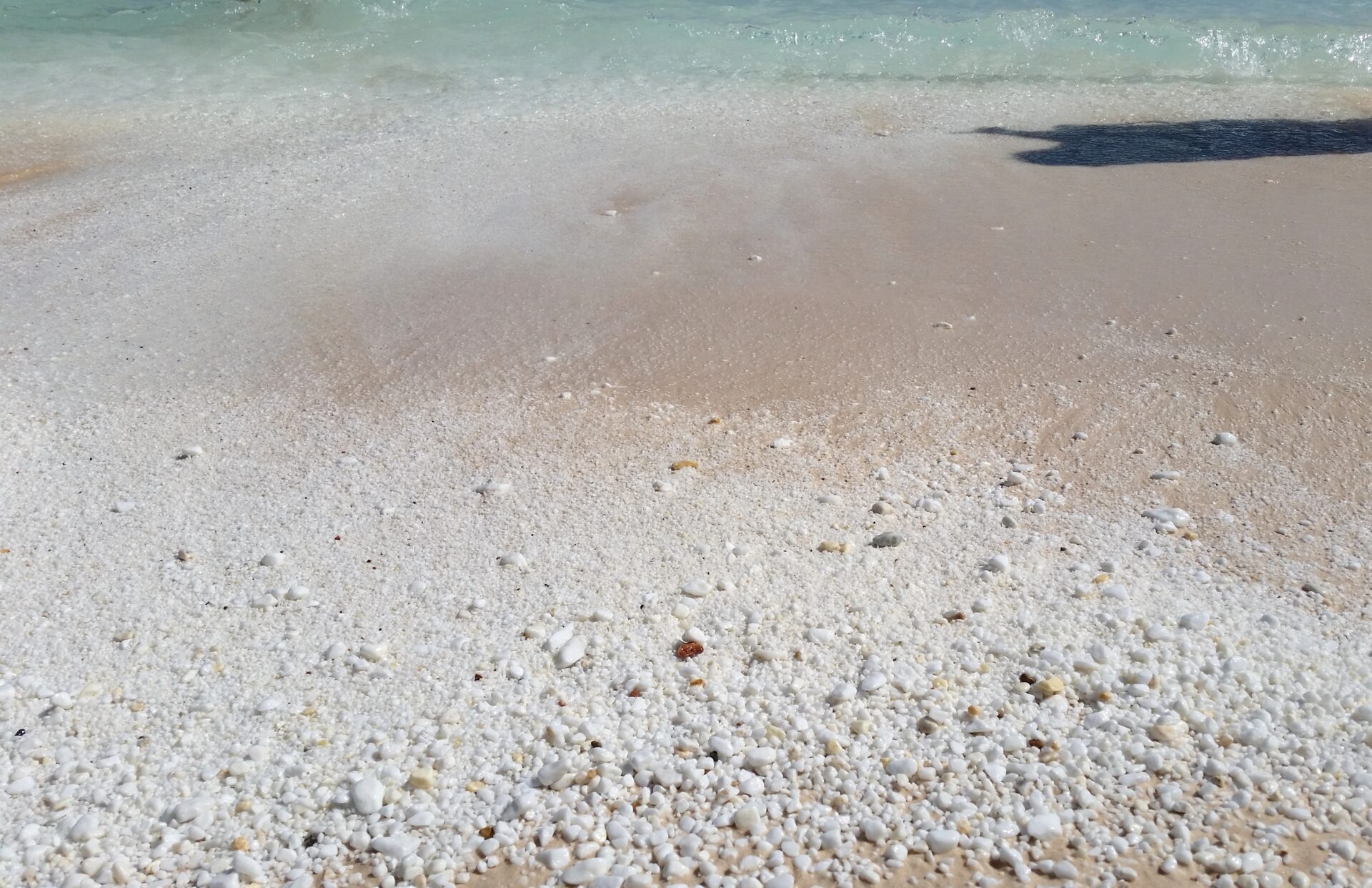 Snowwhite marble pebbles at Marble beach by placescases.com
