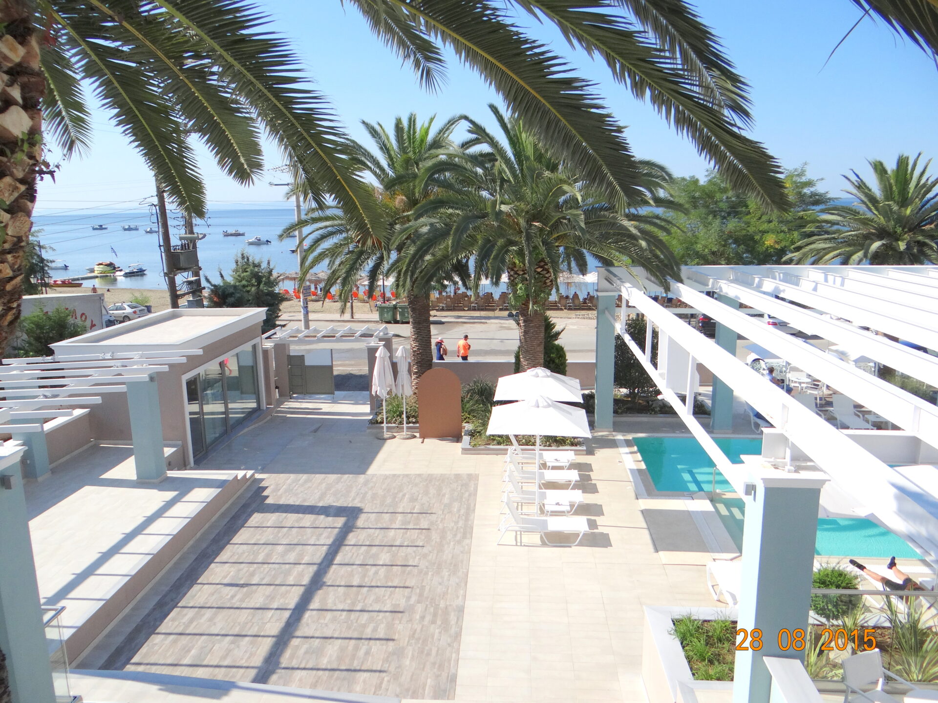 Pool and sea view from suite 214 at Cronwell Sermilia by placescases.com